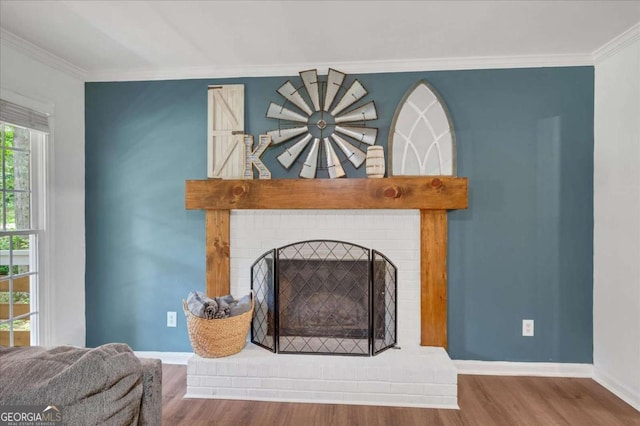 425 Shelby Ln, Hiram, GA 30141 - detailed view of wood finished floors, crown molding, and a brick fireplace