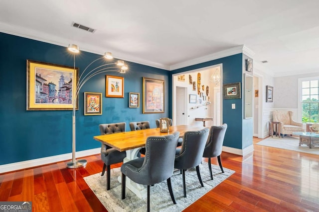 425 Starfire Ct, Suwanee, GA 30024 - dining area featuring crown molding and wood finished floors