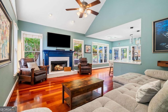 425 Starfire Ct, Suwanee, GA 30024 - living room with a ceiling fan, wood finished floors, a fireplace, high vaulted ceiling, and recessed lighting