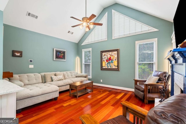 425 Starfire Ct, Suwanee, GA 30024 - living area with a ceiling fan, wood finished floors, high vaulted ceiling, and a fireplace