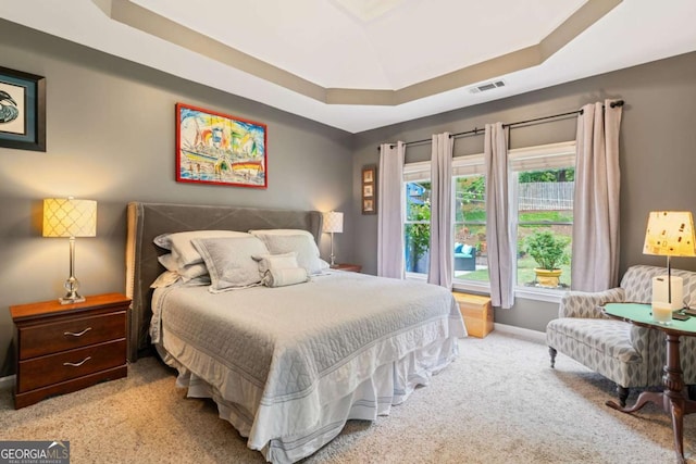 425 Starfire Ct, Suwanee, GA 30024 - carpeted bedroom featuring a raised ceiling and baseboards