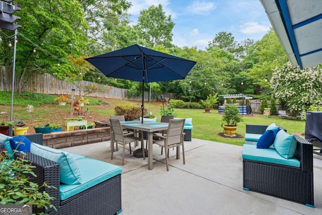 425 Starfire Ct, Suwanee, GA 30024 - fenced backyard with outdoor dining space and a patio
