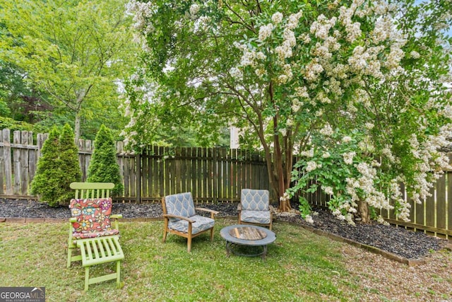 425 Starfire Ct, Suwanee, GA 30024 - fenced backyard featuring a fire pit