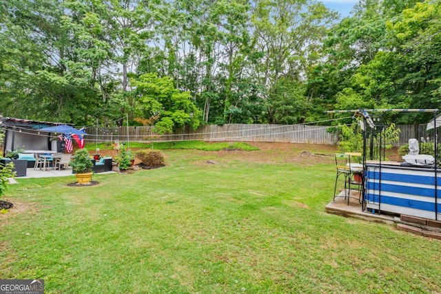 425 Starfire Ct, Suwanee, GA 30024 - fenced backyard with a patio, an outdoor hangout area, and view of scattered trees