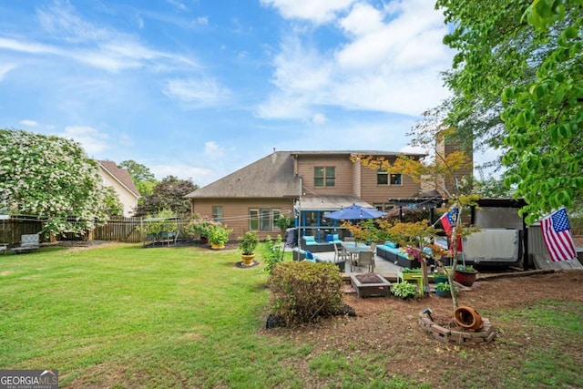 425 Starfire Ct, Suwanee, GA 30024 - rear view of house with a fenced backyard, a chimney, and an outdoor living space with a fire pit