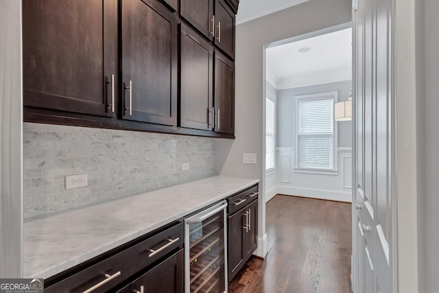 326 Brownstones Cir NE, Atlanta, GA 30312 - kitchen with beverage cooler, ornamental molding, dark brown cabinets, dark wood-type flooring, and backsplash