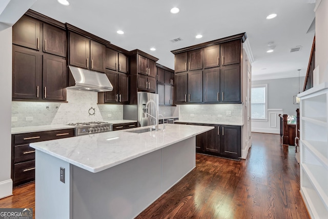 326 Brownstones Cir NE, Atlanta, GA 30312 - kitchen featuring under cabinet range hood, dark brown cabinetry, light stone counters, dark wood-type flooring, and recessed lighting