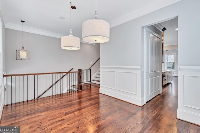 326 Brownstones Cir NE, Atlanta, GA 30312 - unfurnished room with crown molding, wood finished floors, and a wainscoted wall