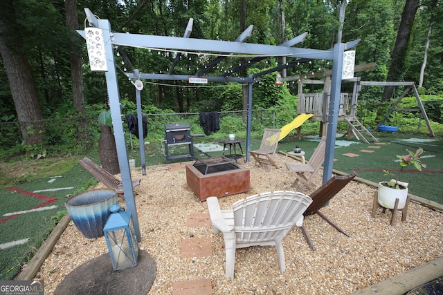 3227 Due W Rd, Dallas, GA 30157 - view of patio / terrace with an outdoor fire pit, a playground, and grilling area