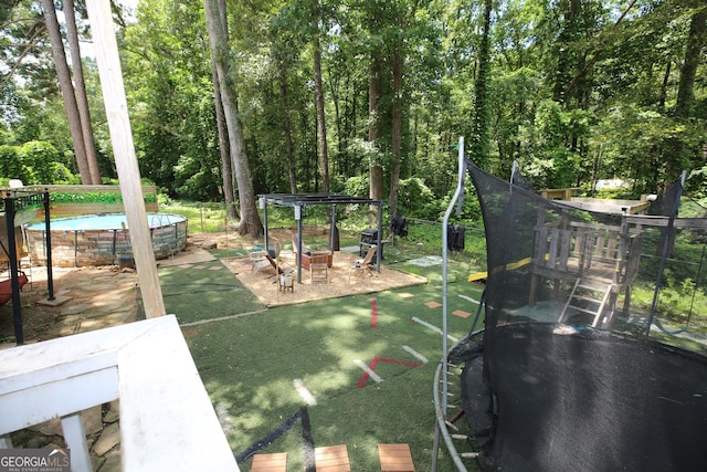3227 Due W Rd, Dallas, GA 30157 - view of jungle gym featuring an outdoor pool and a trampoline