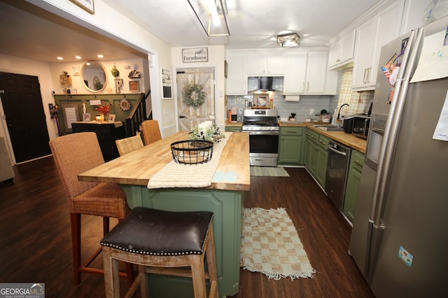 3227 Due W Rd, Dallas, GA 30157 - kitchen featuring appliances with stainless steel finishes, butcher block counters, green cabinetry, range hood, and white cabinetry