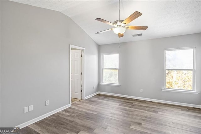 5667 Cascade, Atlanta, GA 30336 - unfurnished room with ceiling fan, lofted ceiling, and wood finished floors