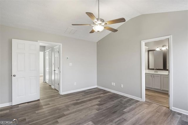 5667 Cascade, Atlanta, GA 30336 - unfurnished bedroom featuring wood finished floors, lofted ceiling, a ceiling fan, and ensuite bath