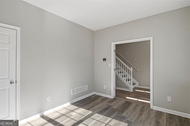 5667 Cascade, Atlanta, GA 30336 - unfurnished room with wood finished floors and stairs