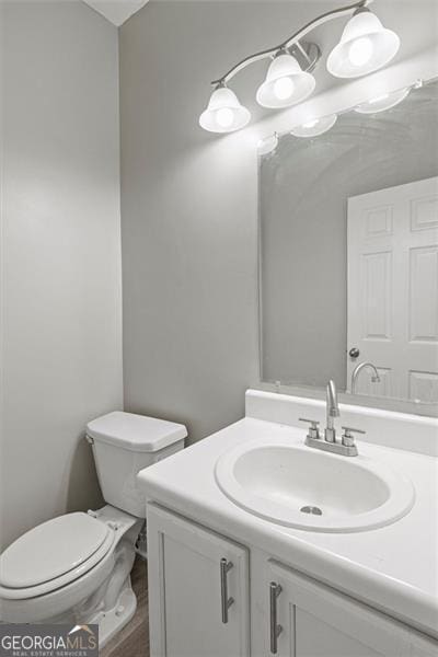 5667 Cascade, Atlanta, GA 30336 - half bathroom featuring vanity and toilet
