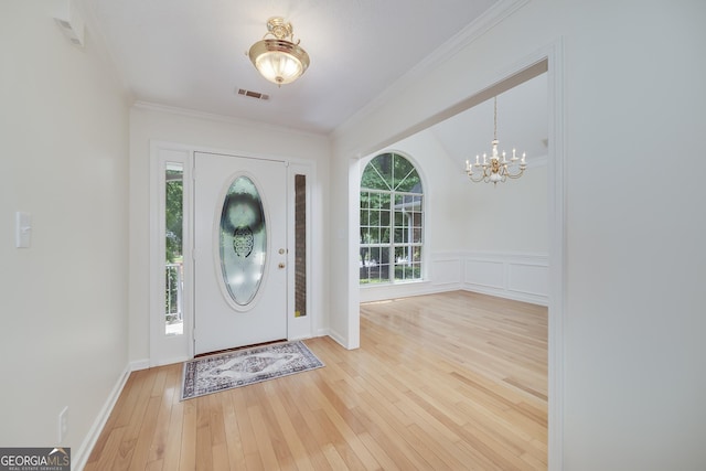 110 Chardonnay Oaks Dr, Mcdonough, GA 30252 - entryway featuring a chandelier, hardwood / wood-style flooring, and crown molding