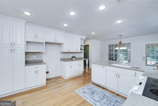 110 Chardonnay Oaks Dr, Mcdonough, GA 30252 - kitchen featuring white dishwasher, open shelves, decorative backsplash, light wood finished floors, and a textured ceiling