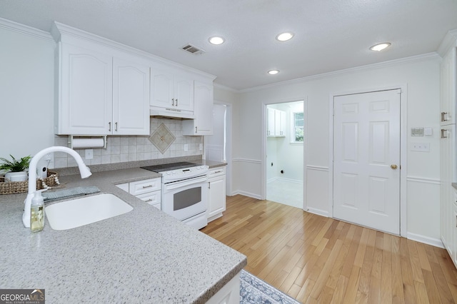 110 Chardonnay Oaks Dr, Mcdonough, GA 30252 - kitchen with white range with electric cooktop, white cabinets, backsplash, crown molding, and under cabinet range hood