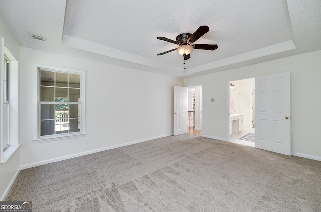 110 Chardonnay Oaks Dr, Mcdonough, GA 30252 - unfurnished bedroom with a tray ceiling, ornamental molding, carpet, a textured ceiling, and ensuite bath
