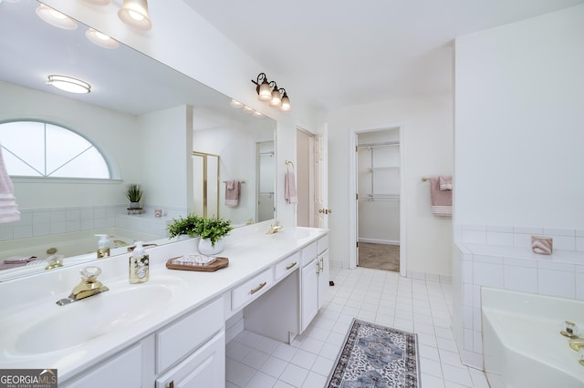110 Chardonnay Oaks Dr, Mcdonough, GA 30252 - full bath with double vanity, a garden tub, a spacious closet, tile patterned flooring, and a stall shower