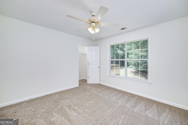 110 Chardonnay Oaks Dr, Mcdonough, GA 30252 - carpeted empty room with a ceiling fan and a textured ceiling