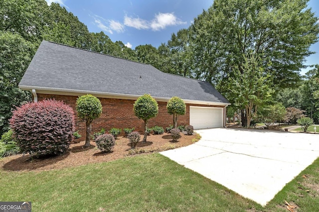 110 Chardonnay Oaks Dr, Mcdonough, GA 30252 - view of side of property with concrete driveway, roof with shingles, brick siding, a yard, and a garage