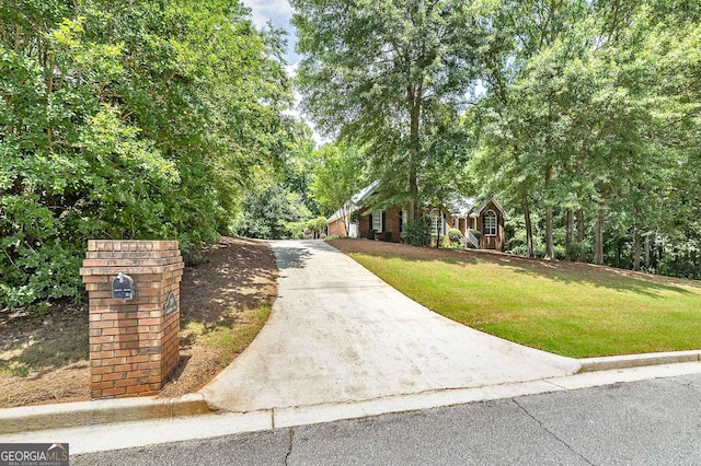 110 Chardonnay Oaks Dr, Mcdonough, GA 30252 - view of front of house with a front lawn and driveway