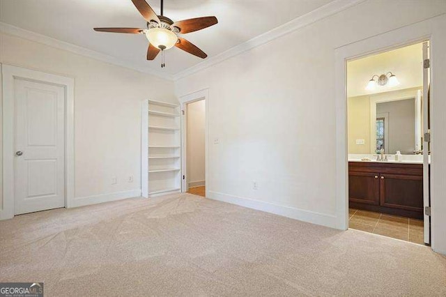 3202 Saute Way, Avondale Estates, GA 30002 - unfurnished bedroom featuring light colored carpet, ornamental molding, connected bathroom, a walk in closet, and ceiling fan
