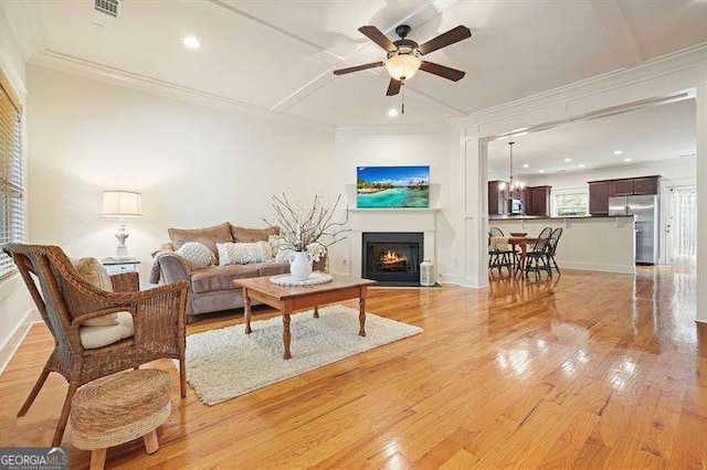 3202 Saute Way, Avondale Estates, GA 30002 - living room featuring light wood-type flooring, a fireplace with flush hearth, a ceiling fan, ornamental molding, and recessed lighting