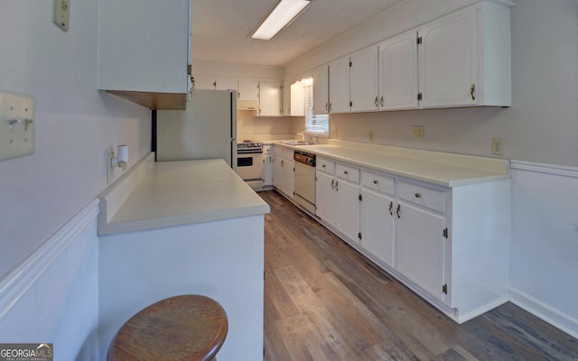 37 Cunningham Dr, Hartwell, GA 30643 - kitchen with white appliances, dark wood-style flooring, white cabinets, and light countertops