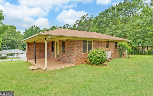 37 Cunningham Dr, Hartwell, GA 30643 - rear view of house featuring a yard, brick siding, and a patio