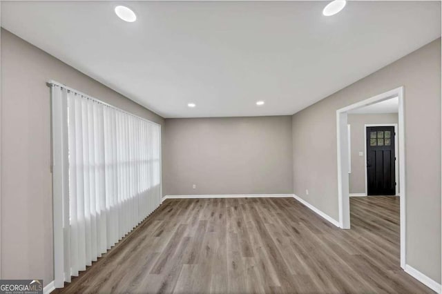 847 Magna Carta Dr NW, Atlanta, GA 30318 - unfurnished room with wood finished floors and recessed lighting
