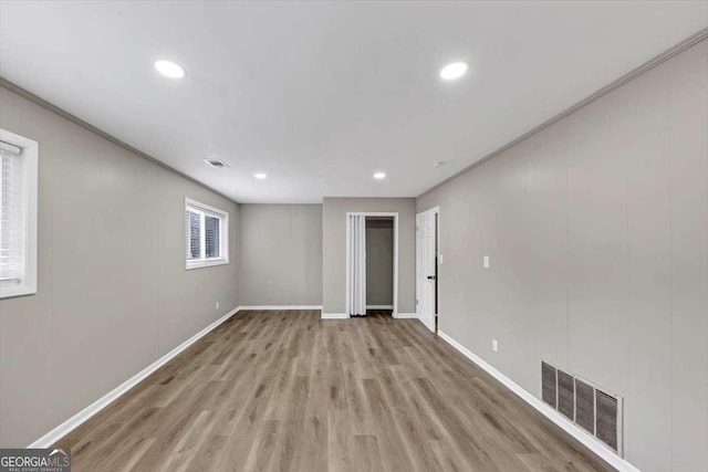 847 Magna Carta Dr NW, Atlanta, GA 30318 - empty room with recessed lighting and wood finished floors