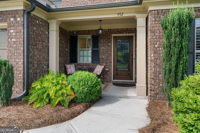452 Rockford Pass, Marietta, GA 30064 - doorway to property featuring covered porch and brick siding