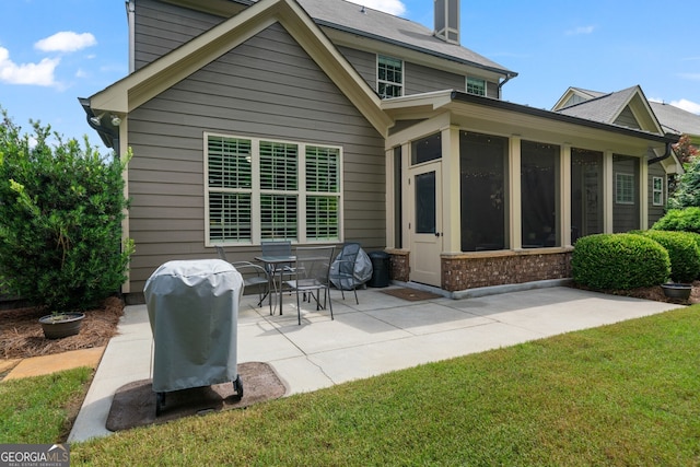 452 Rockford Pass, Marietta, GA 30064 - back of property featuring a patio area, a sunroom, brick siding, and a lawn