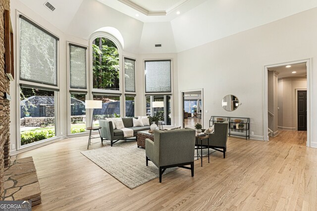 625 Wynfield Ct, Roswell, GA 30076 - living room featuring a towering ceiling, wood finished floors, ornamental molding, stairway, and recessed lighting