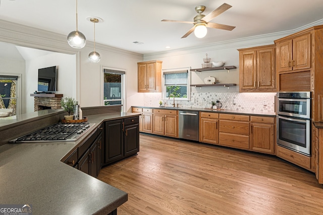 625 Wynfield Ct, Roswell, GA 30076 - kitchen featuring appliances with stainless steel finishes, dark countertops, ceiling fan, tasteful backsplash, and ornamental molding