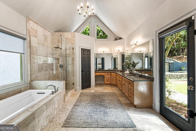 625 Wynfield Ct, Roswell, GA 30076 - bathroom featuring a stall shower, double vanity, a chandelier, plenty of natural light, and high vaulted ceiling