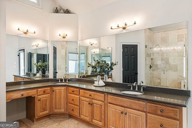 625 Wynfield Ct, Roswell, GA 30076 - bathroom featuring vaulted ceiling, a shower stall, double vanity, and tile patterned flooring