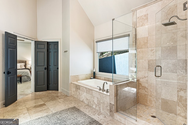 625 Wynfield Ct, Roswell, GA 30076 - ensuite bathroom featuring high vaulted ceiling, a garden tub, and a stall shower