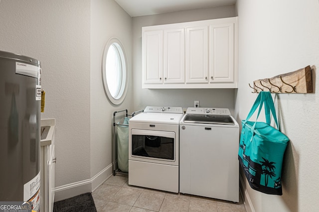 625 Wynfield Ct, Roswell, GA 30076 - laundry area featuring washer and clothes dryer, water heater, cabinet space, and light tile patterned floors
