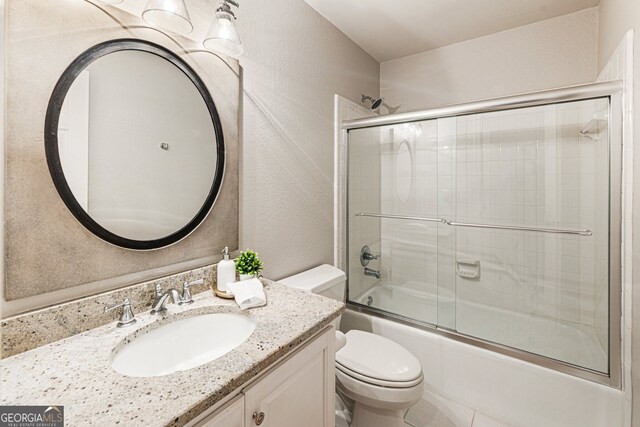 625 Wynfield Ct, Roswell, GA 30076 - full bathroom with vanity, a textured wall, and shower / bath combination with glass door