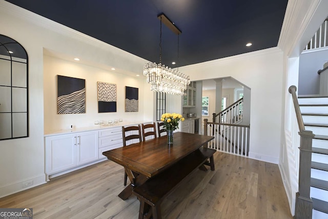 1895 Henley Way, Alpharetta, GA 30009 - dining space with stairs, light wood finished floors, ornamental molding, a chandelier, and recessed lighting