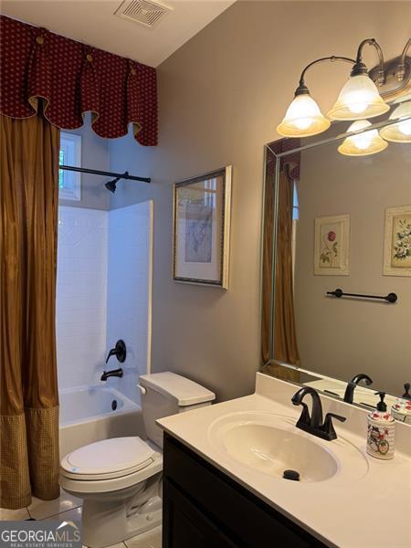 1464 Chatsworth Trce, Lawrenceville, GA 30044 - bathroom featuring vanity, tile patterned floors, and shower / tub combo with curtain