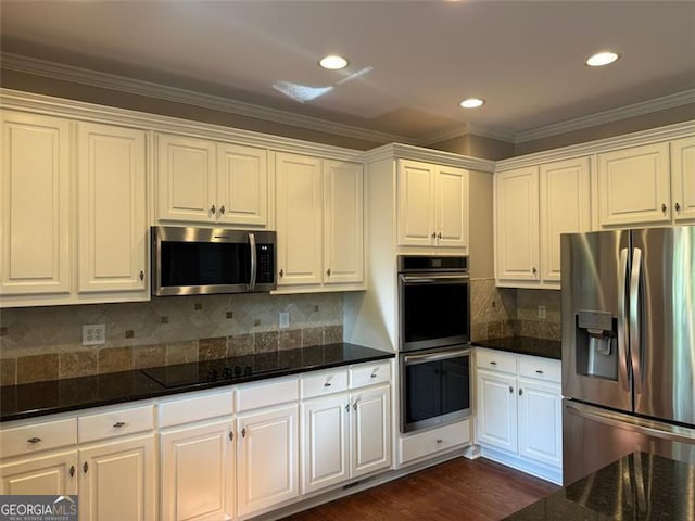 1464 Chatsworth Trce, Lawrenceville, GA 30044 - kitchen with stainless steel appliances, white cabinets, dark stone counters, crown molding, and recessed lighting