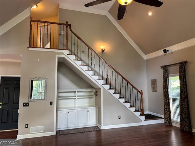 1464 Chatsworth Trce, Lawrenceville, GA 30044 - staircase featuring high vaulted ceiling, ceiling fan, and wood finished floors