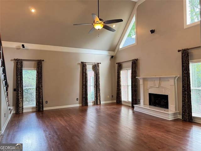 1464 Chatsworth Trce, Lawrenceville, GA 30044 - unfurnished living room with high vaulted ceiling, a ceiling fan, dark wood-style flooring, stairway, and a fireplace