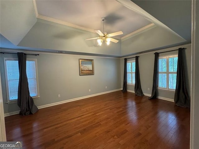 1464 Chatsworth Trce, Lawrenceville, GA 30044 - spare room with a raised ceiling, ceiling fan, dark wood-type flooring, and ornamental molding