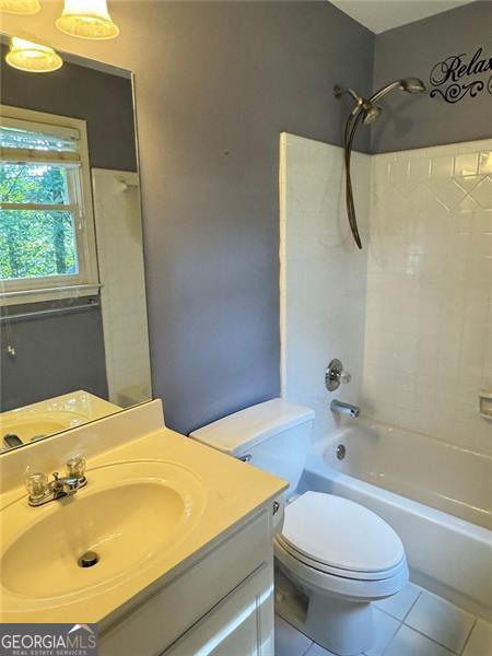 1464 Chatsworth Trce, Lawrenceville, GA 30044 - bathroom with tile patterned floors, tub / shower combination, and vanity