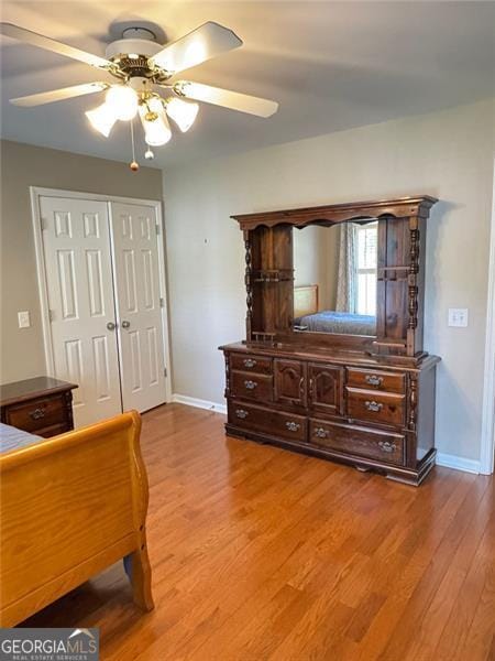 1464 Chatsworth Trce, Lawrenceville, GA 30044 - bedroom with light wood-style floors, a closet, and a ceiling fan